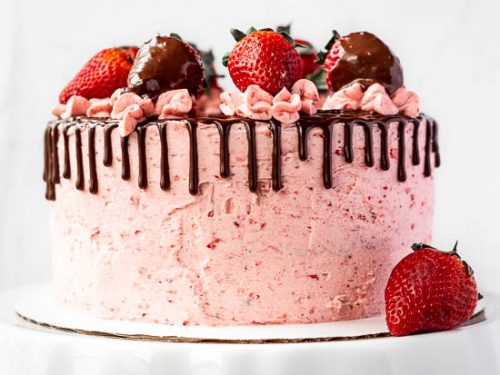 White Chocolate Strawberry Yogurt Cake Decorated With Fresh Fruits And  Chocolate Chunk On Wood Table Near Window. Delicious And Sweet Pink Cake  For Valentines Or Birthday. Homemade Bakery Concept. Stock Photo, Picture